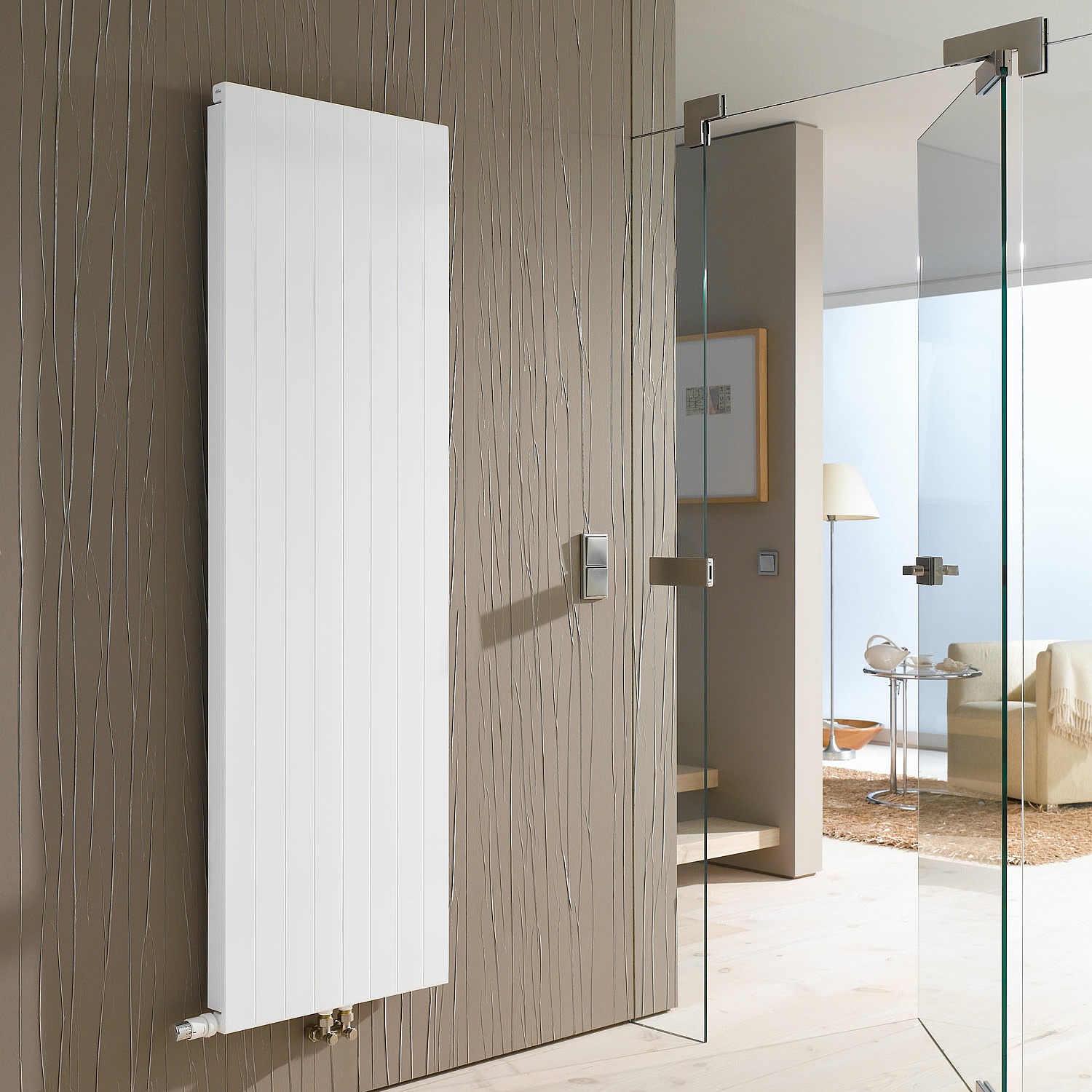 A vertical, slimline version of the KERMI valve heating panel in the form of a radiator that is tailored specifically to foyers, stairwells, and lobbies.